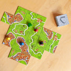 Carcassonne landscape tiles spread showing cities roads and farms – tile laying game India