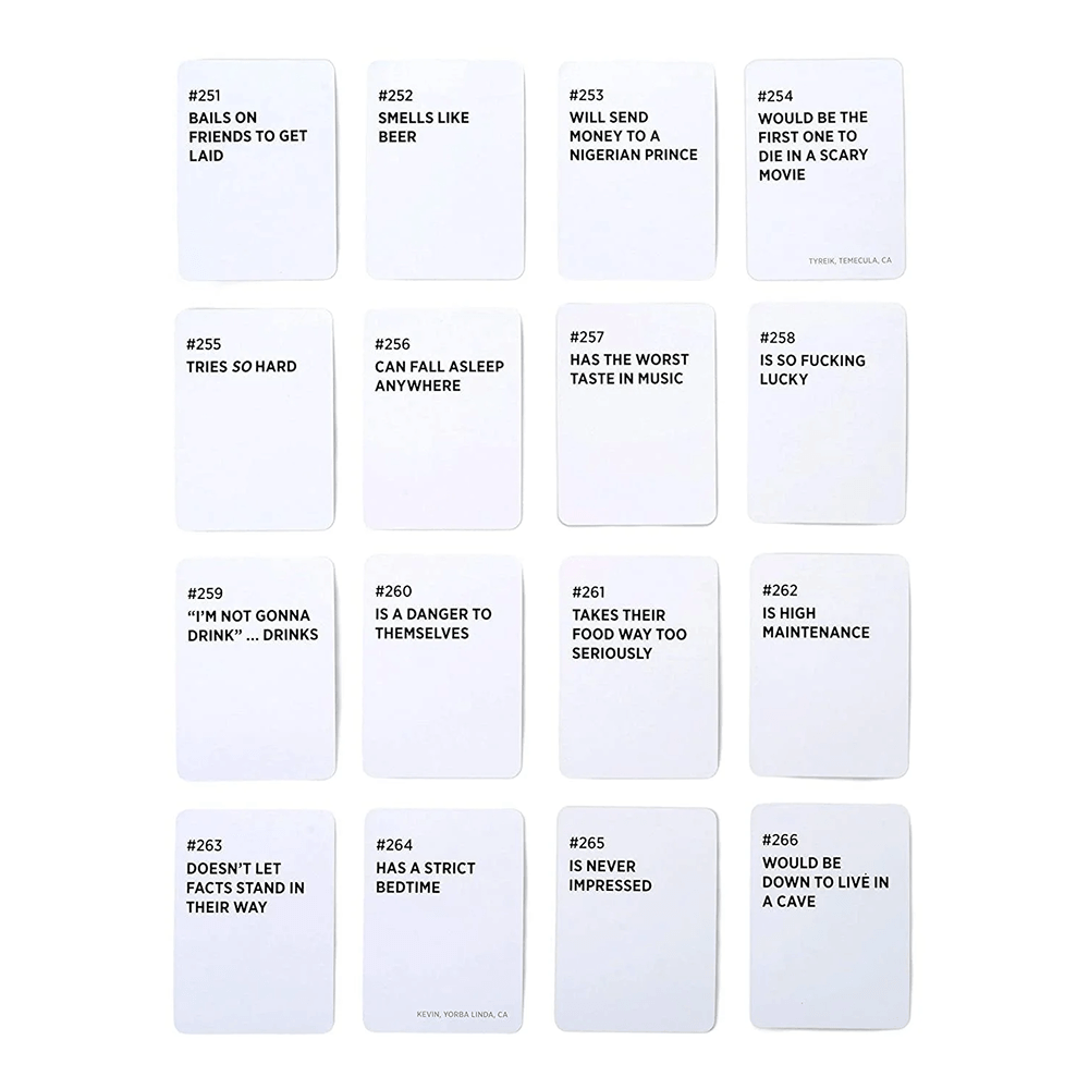 Drunk Stoned or Stupid card game box and 250 prompt cards spread on a table — adult party roast game for 3 or more players